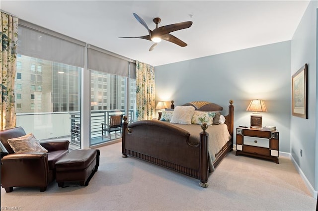 carpeted bedroom featuring ceiling fan and access to exterior