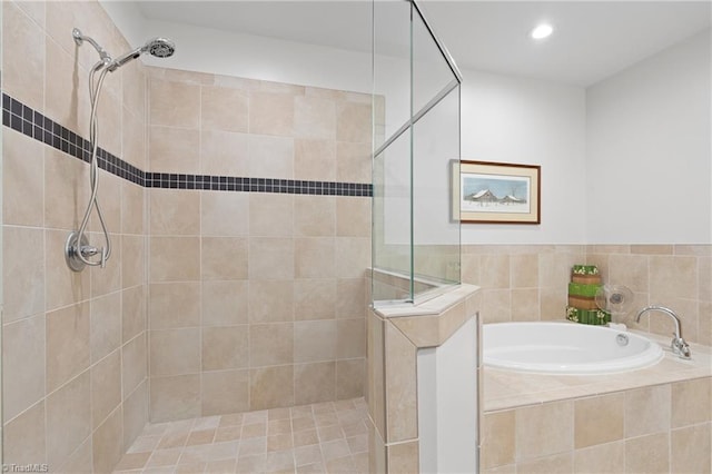 bathroom with separate shower and tub