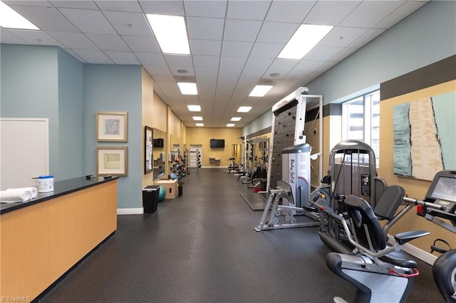 workout area featuring a drop ceiling