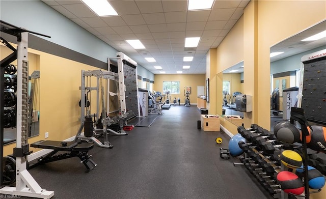 exercise room with a drop ceiling