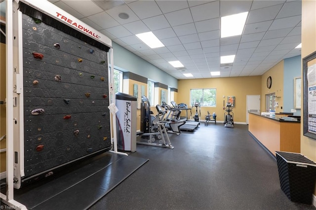 workout area with a paneled ceiling