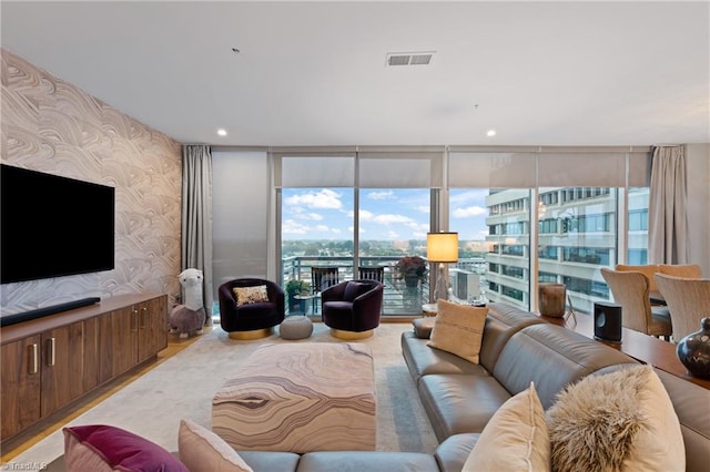 living room with a wealth of natural light and expansive windows