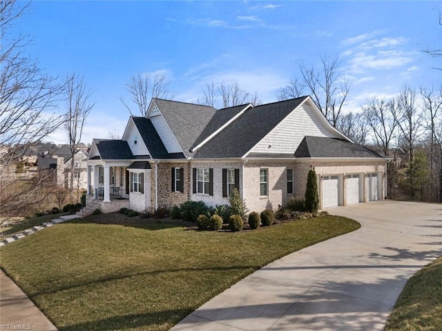 view of front of property featuring a garage, brick siding, concrete driveway, and a front yard