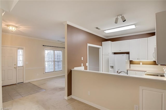 kitchen featuring white cabinets, light colored carpet, kitchen peninsula, crown molding, and white appliances