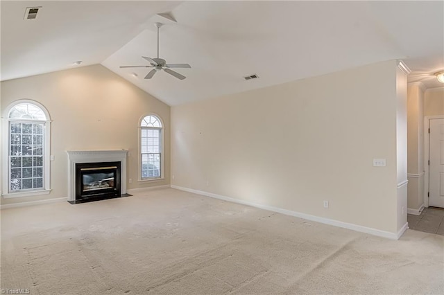 unfurnished living room featuring light carpet, vaulted ceiling, and ceiling fan