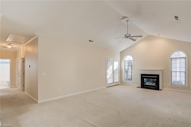 unfurnished living room with light carpet, vaulted ceiling, and ceiling fan