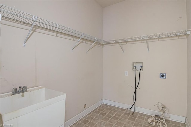 laundry room featuring sink, hookup for a washing machine, and hookup for an electric dryer