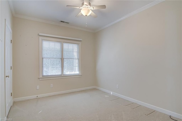 carpeted empty room with crown molding and ceiling fan