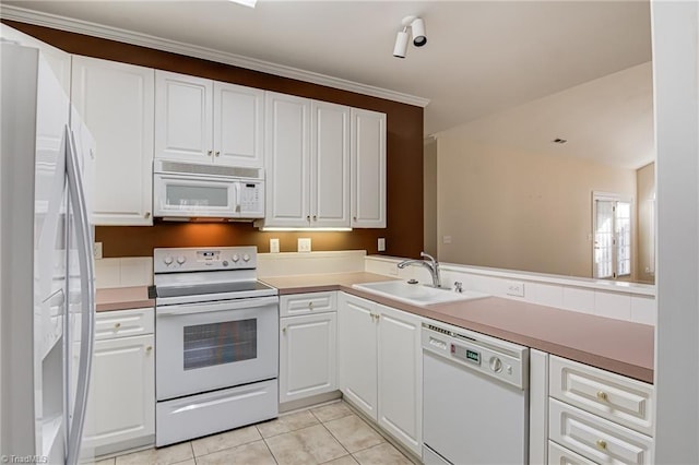 kitchen featuring light tile patterned flooring, sink, white cabinets, kitchen peninsula, and white appliances