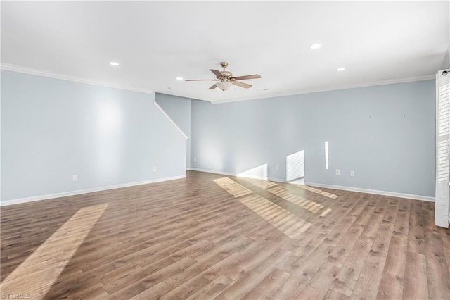 unfurnished room featuring light wood-type flooring, ceiling fan, and crown molding