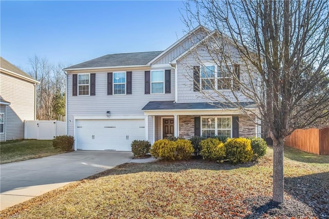 view of front of property with a garage and a front yard