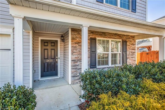 property entrance featuring a porch