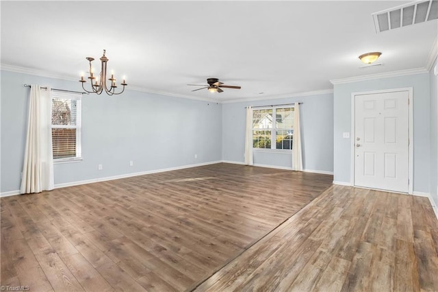 interior space featuring hardwood / wood-style floors, ceiling fan with notable chandelier, and ornamental molding