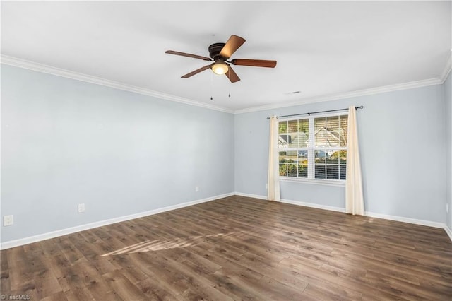 empty room featuring ceiling fan, dark wood-type flooring, and crown molding