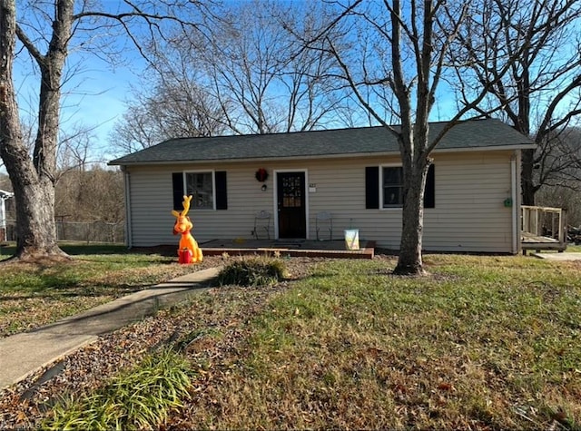 ranch-style home with a front lawn