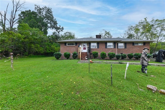 ranch-style home with a front lawn