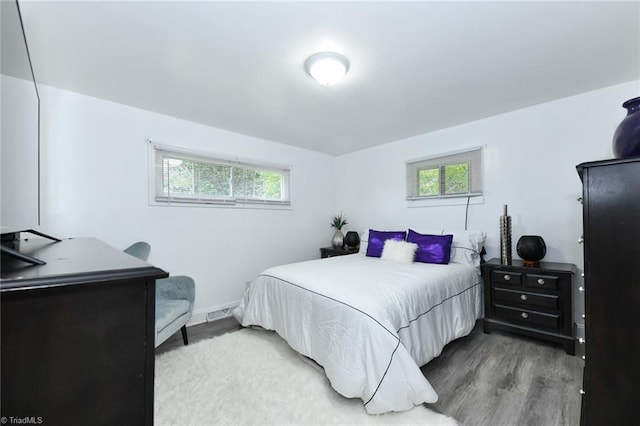 bedroom with wood-type flooring