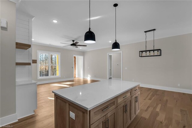 kitchen featuring light wood-type flooring, pendant lighting, recessed lighting, and open shelves