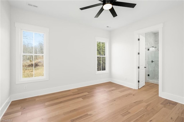 unfurnished bedroom featuring light wood-type flooring, visible vents, and baseboards