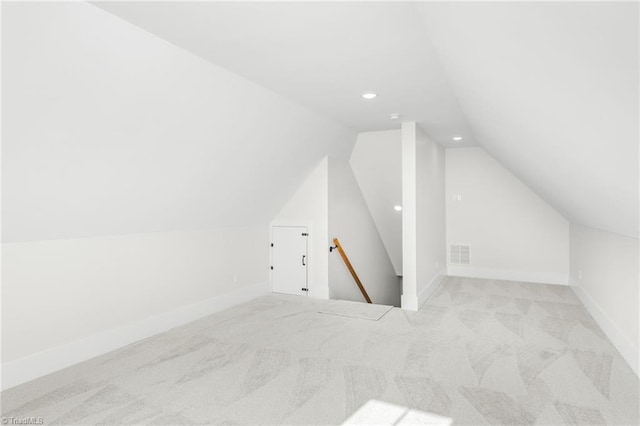 bonus room with lofted ceiling, carpet, visible vents, and baseboards