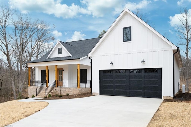 modern inspired farmhouse with board and batten siding, covered porch, roof with shingles, and concrete driveway