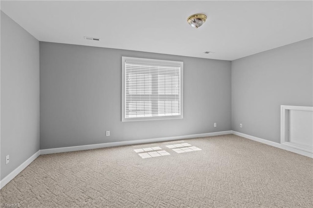 unfurnished room with carpet flooring