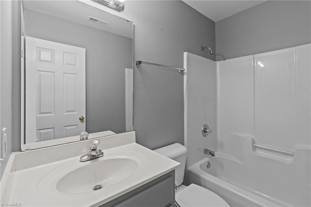 full bathroom with vanity, shower / bathtub combination, and toilet