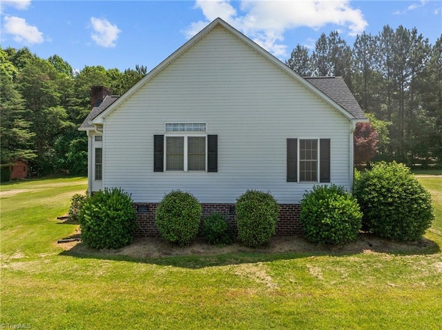 view of home's exterior with a lawn