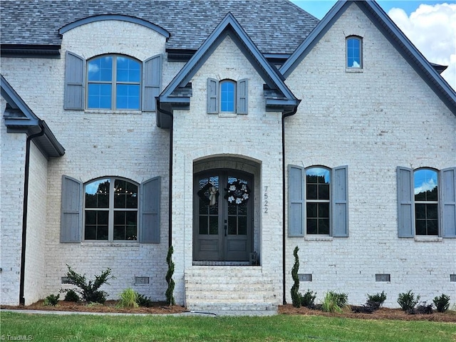 french country style house featuring french doors