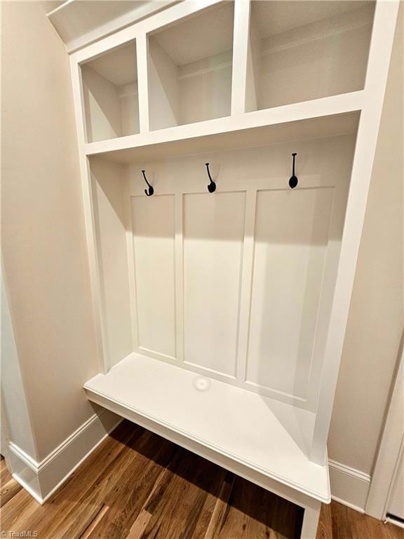 mudroom with wood-type flooring