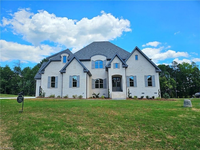 french country home with a front yard