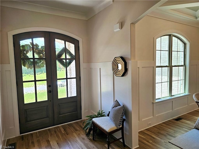 entryway featuring a wealth of natural light, french doors, crown molding, and dark hardwood / wood-style floors