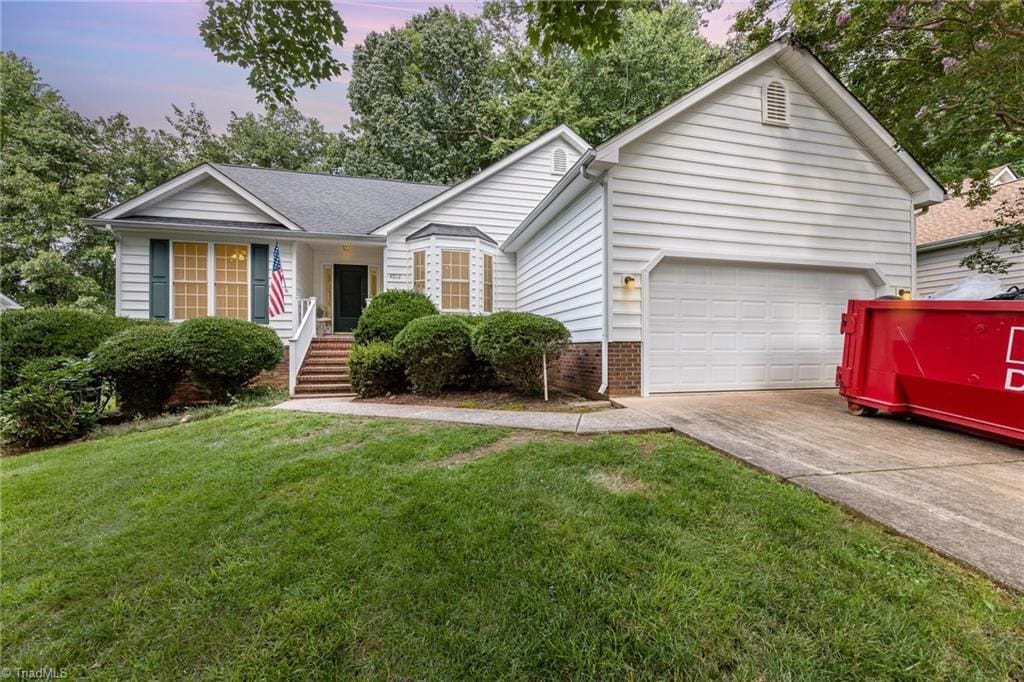 4012 Thorncrest Dr, Greensboro, NC 27407 - single story home featuring driveway, a garage, and a front lawn