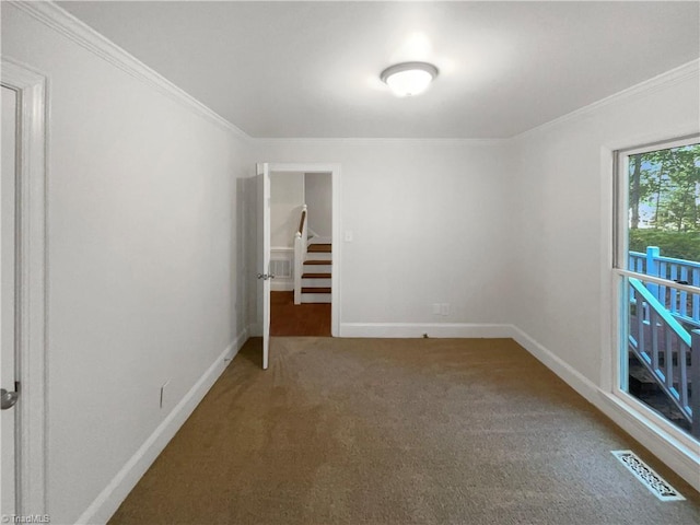 5605 Southstone Dr, Greensboro, NC 27406 - carpeted spare room featuring baseboards and crown molding