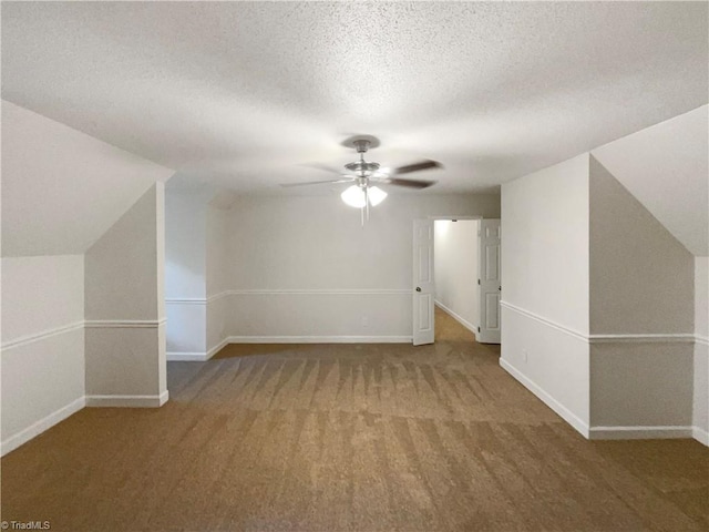 5605 Southstone Dr, Greensboro, NC 27406 - bonus room featuring carpet flooring, ceiling fan, a textured ceiling, baseboards, and lofted ceiling