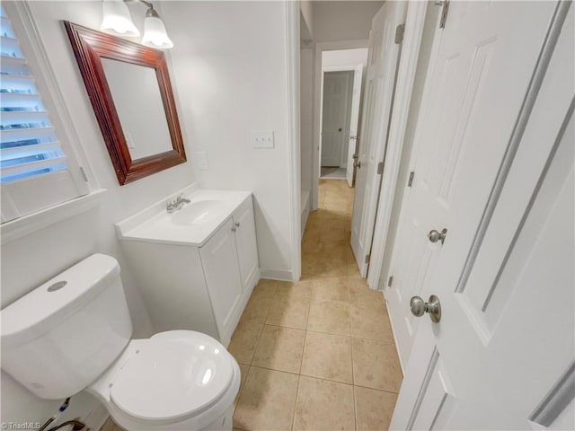 5605 Southstone Dr, Greensboro, NC 27406 - bathroom featuring vanity, tile patterned floors, toilet, and baseboards