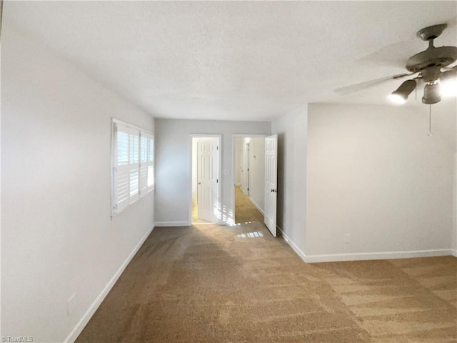 5605 Southstone Dr, Greensboro, NC 27406 - carpeted spare room featuring baseboards and a ceiling fan