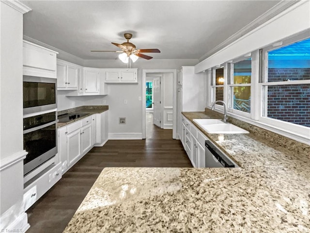 5605 Southstone Dr, Greensboro, NC 27406 - kitchen with a sink, stainless steel appliances, a ceiling fan, light stone countertops, and white cabinetry