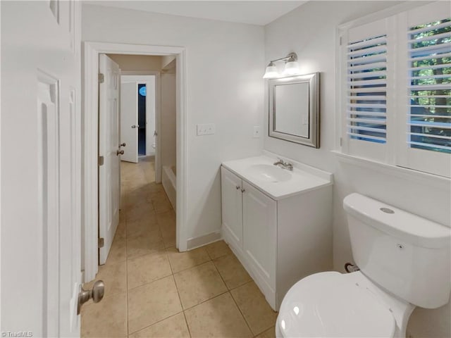 5605 Southstone Dr, Greensboro, NC 27406 - bathroom with tile patterned floors, vanity, toilet, and baseboards