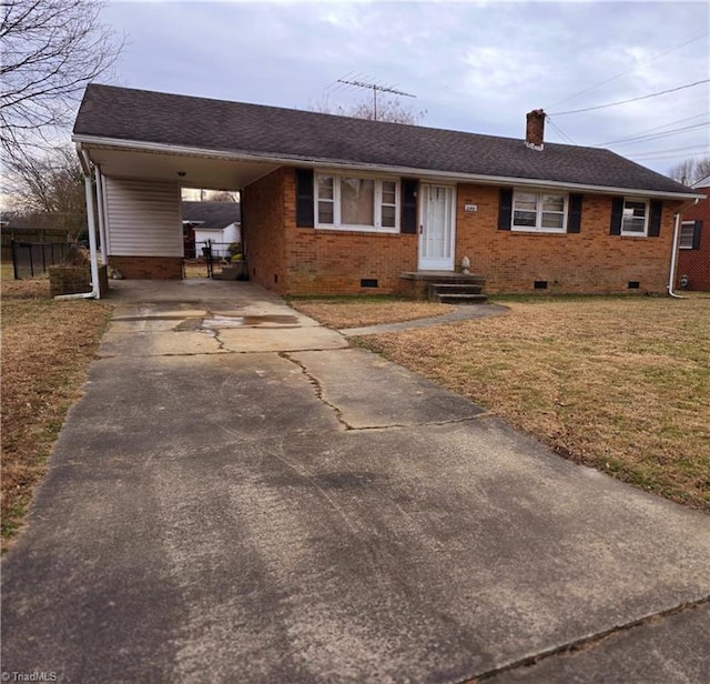 ranch-style home with a carport and a front yard