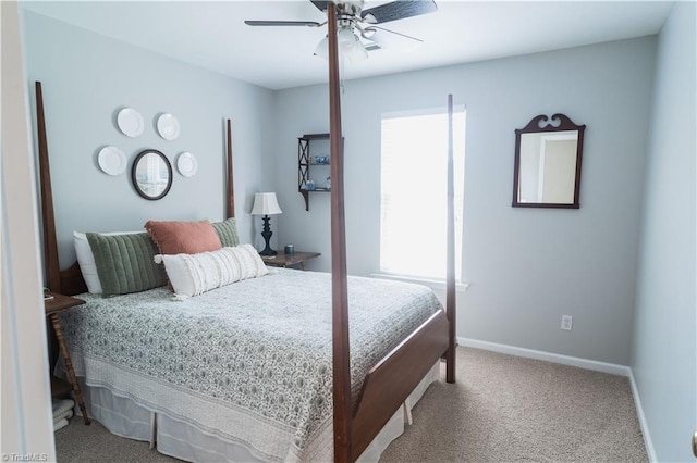 carpeted bedroom with baseboards and a ceiling fan