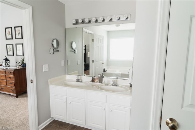 full bathroom featuring double vanity and a garden tub