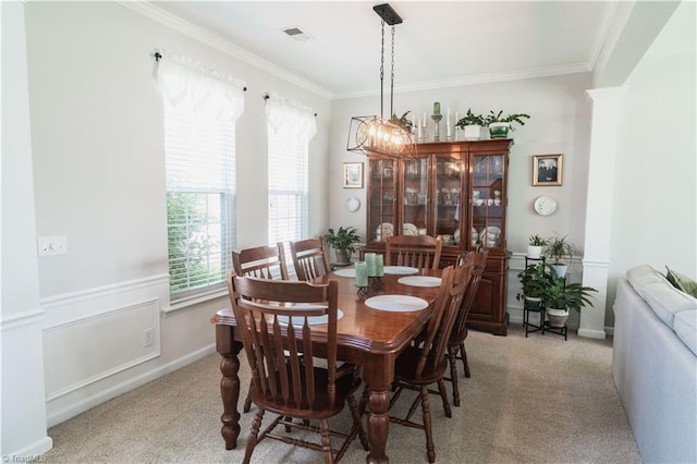 dining space with light colored carpet and ornamental molding