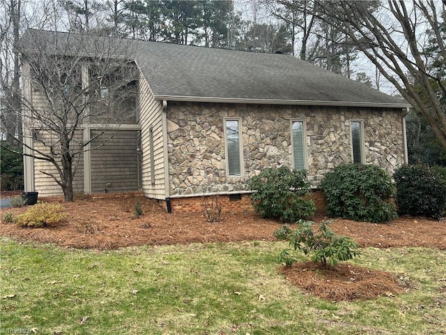 view of side of property with a yard