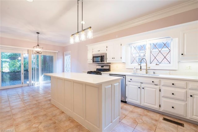 kitchen featuring a sink, a chandelier, stainless steel appliances, light countertops, and visible vents
