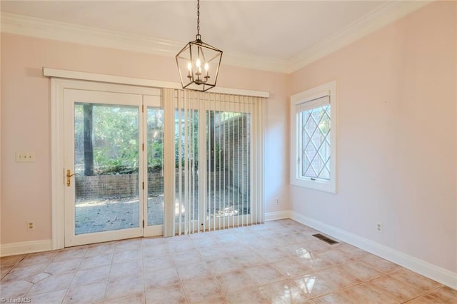 unfurnished dining area with baseboards, crown molding, a chandelier, and visible vents