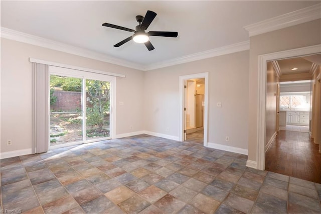empty room featuring baseboards, stone finish flooring, ceiling fan, and crown molding