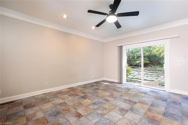spare room featuring stone finish flooring, baseboards, and ornamental molding