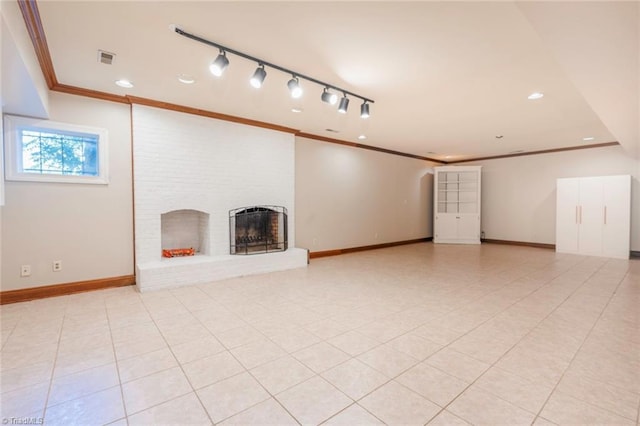 unfurnished living room featuring visible vents, baseboards, a brick fireplace, and ornamental molding