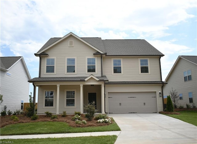 craftsman inspired home with a front yard, a porch, and a garage